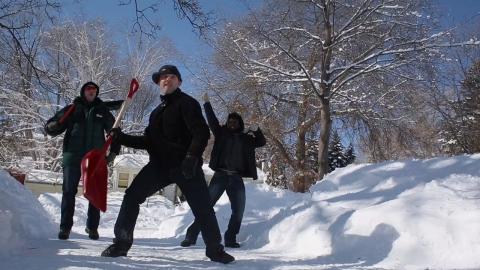 David dancing with shovel in snow
